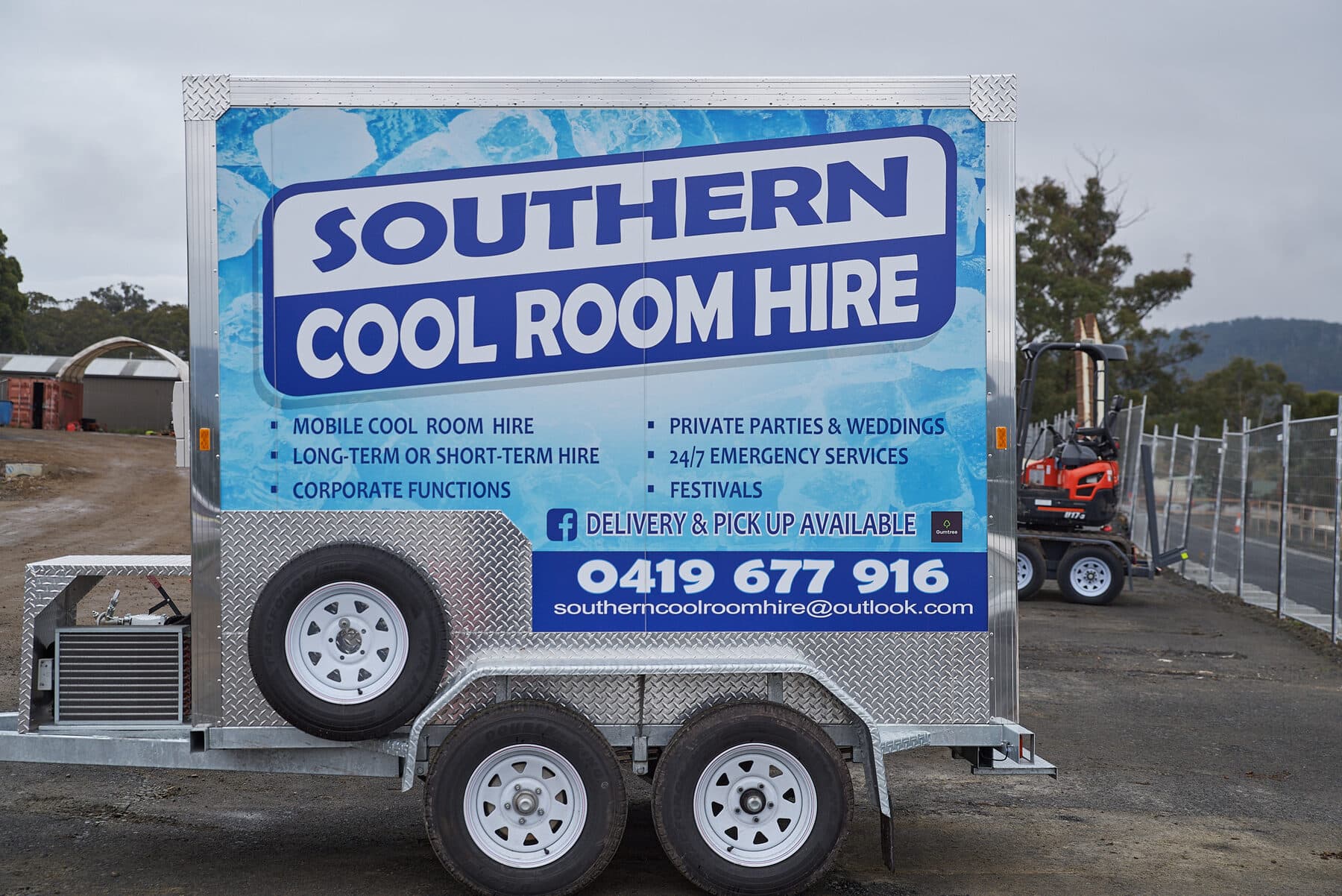 A Southern Cool Room Hire mobile cool room trailer in the yard