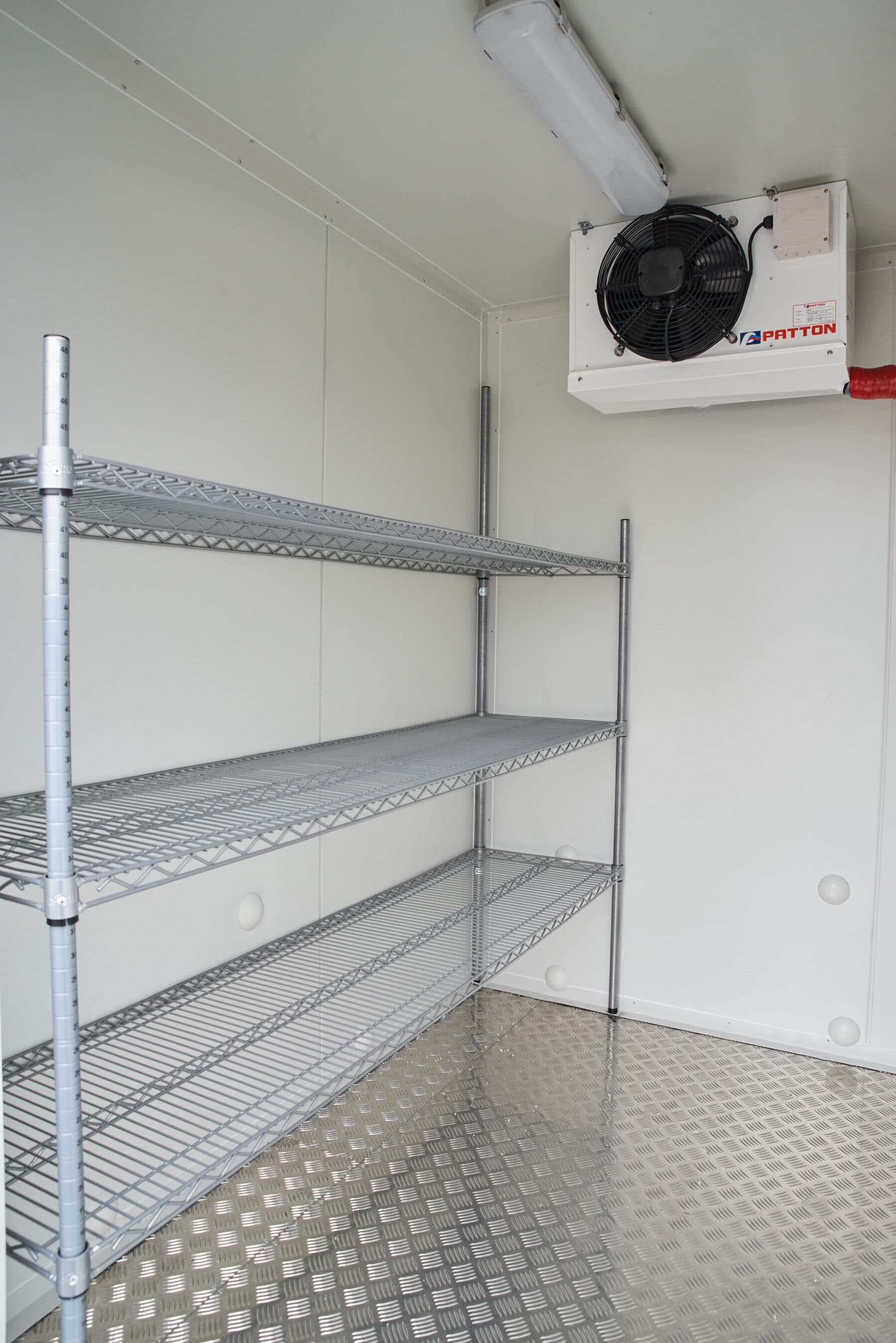Wire shelving inside a cool room trailer